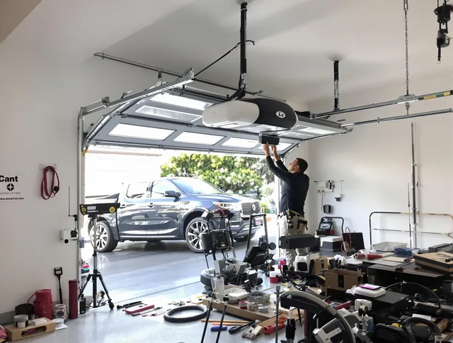 Pooler Garage Door Repair specialist installing smart garage door opener system in Pooler home
